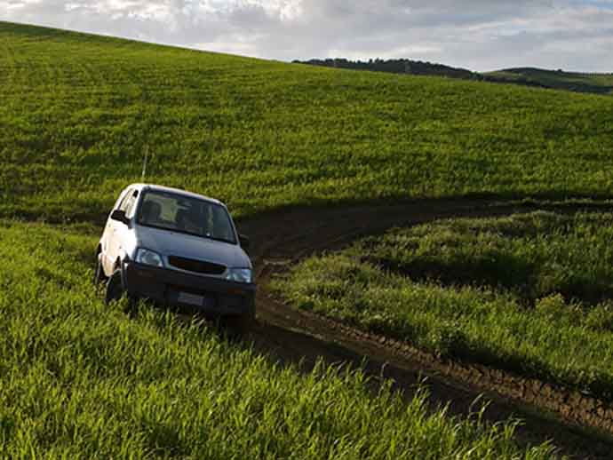 Daihatsu off roading on a field Daihatsu off roading on a field