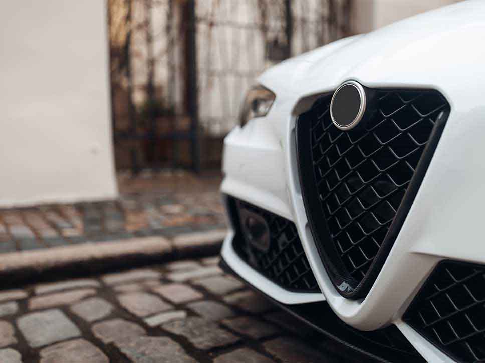 Front bumper of a white Alfa Romeo
