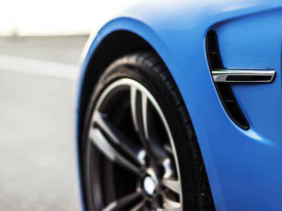 Blue BMW fender close up