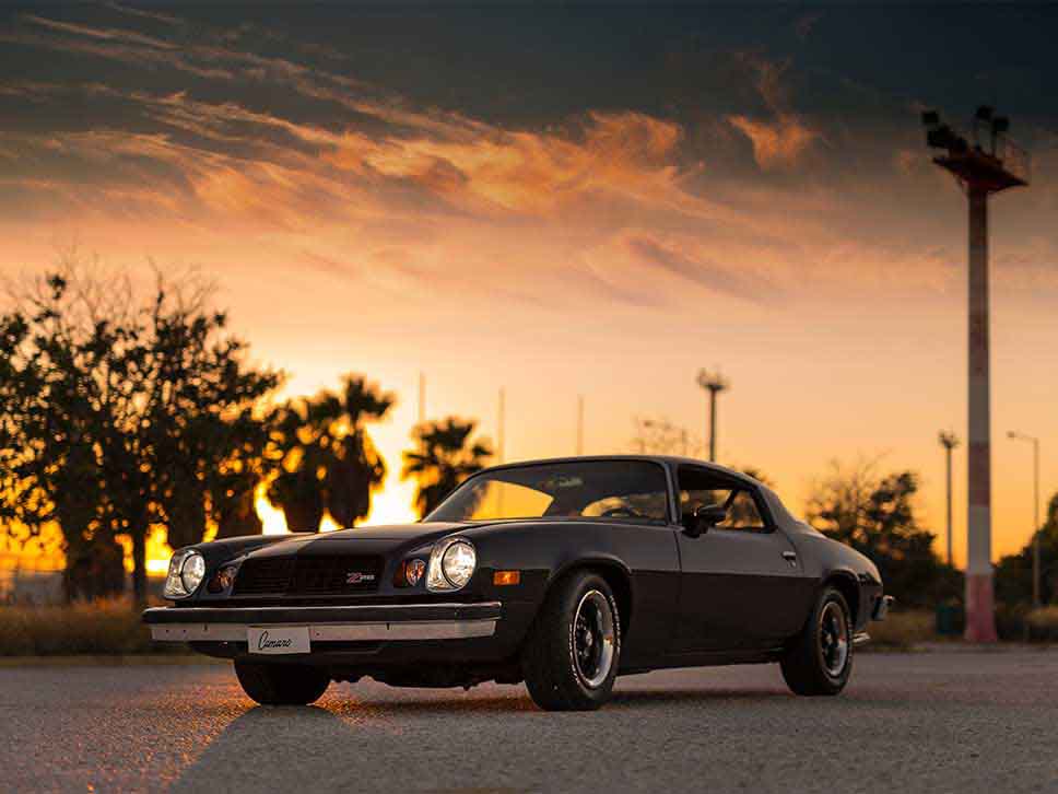 Classic Chevrolet Camaro on a sunset view