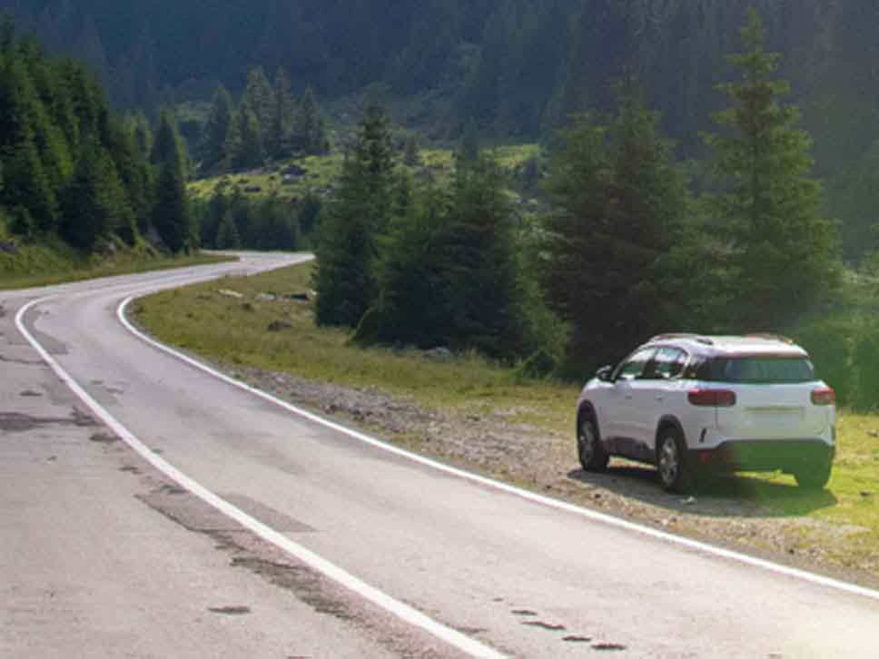 White Citroen parked up with scenery