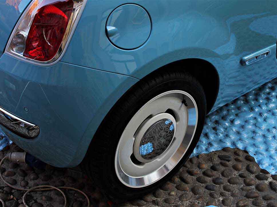 Blue Fiat 500 with white steelies
