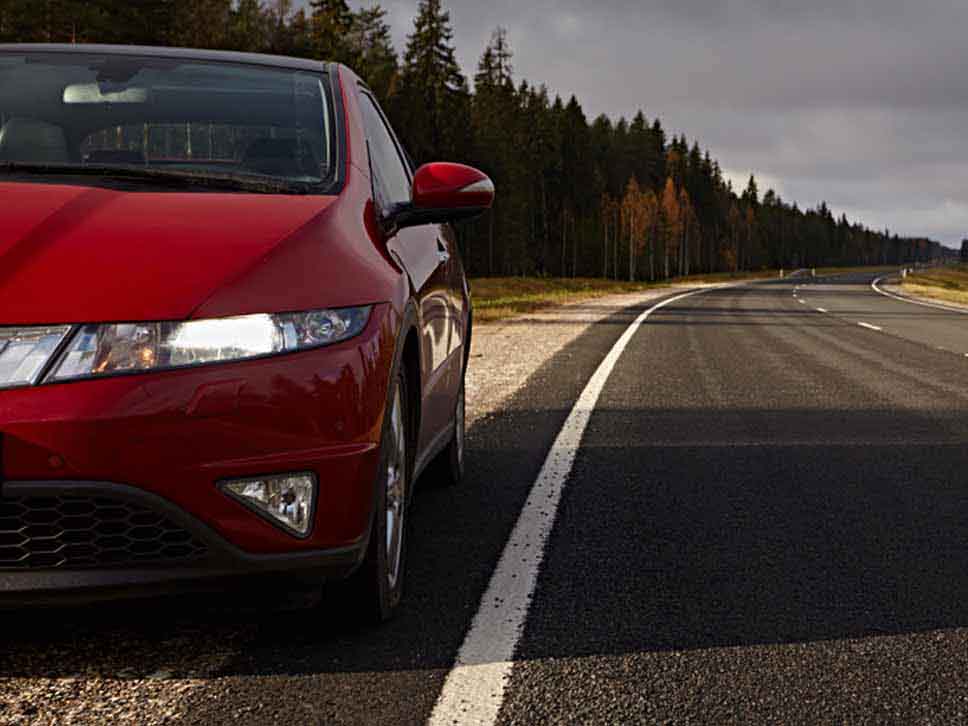 Red Honda Civic pulled over to the side of the road
