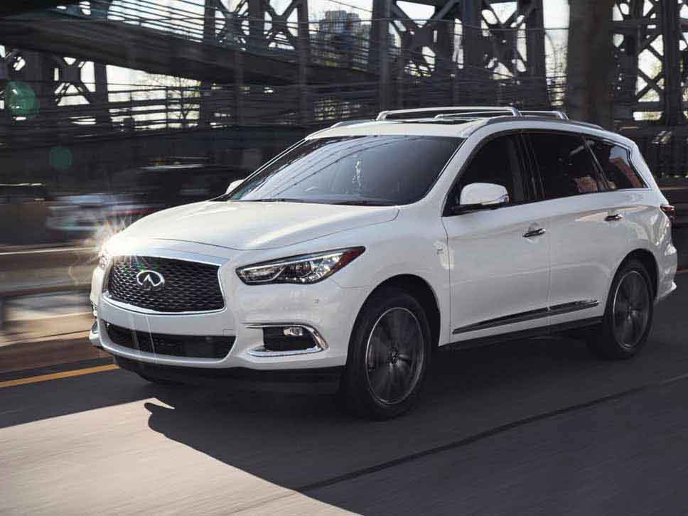 White Infiniti driving