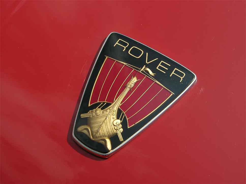 Rover emblem on red bonnet close up