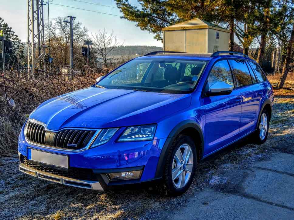 Blue Skoda estate parked up during a winter morning