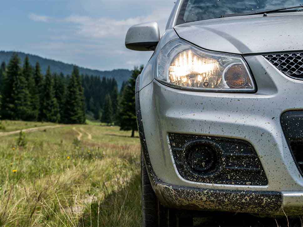 Suzuki headlight covered in mud
